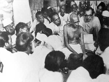 Gandhiji discussing about the communal riot at Beliaghata House in Calcutta.jpg